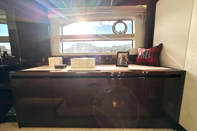Highland Patriot Yacht Photos Pics Luxurious interior of 2023 Prestige 590 yacht with sunlight streaming through window.
