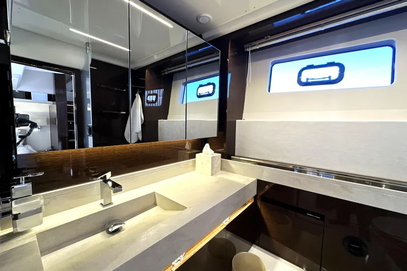 Highland Patriot Yacht Photos Pics Luxurious bathroom interior of 2023 Prestige 590 yacht with modern fixtures and sleek design.