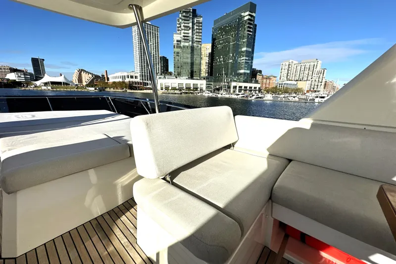 Highland Patriot Yacht Photos Pics Luxury 2023 Prestige 590 yacht interior with city skyline view.