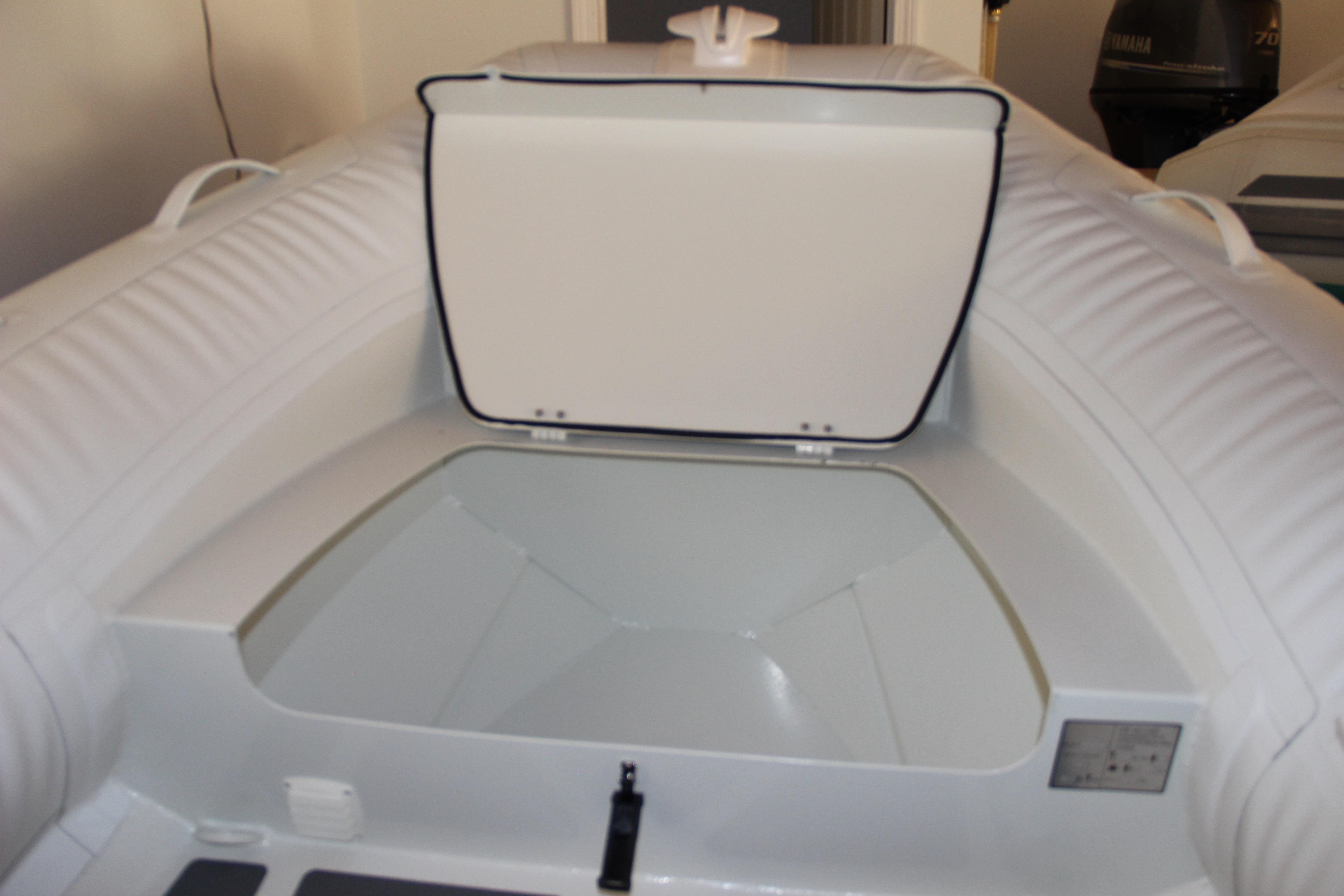 2022 ZAR Mini RIB 14 HDL inflatable boat with open storage compartment.