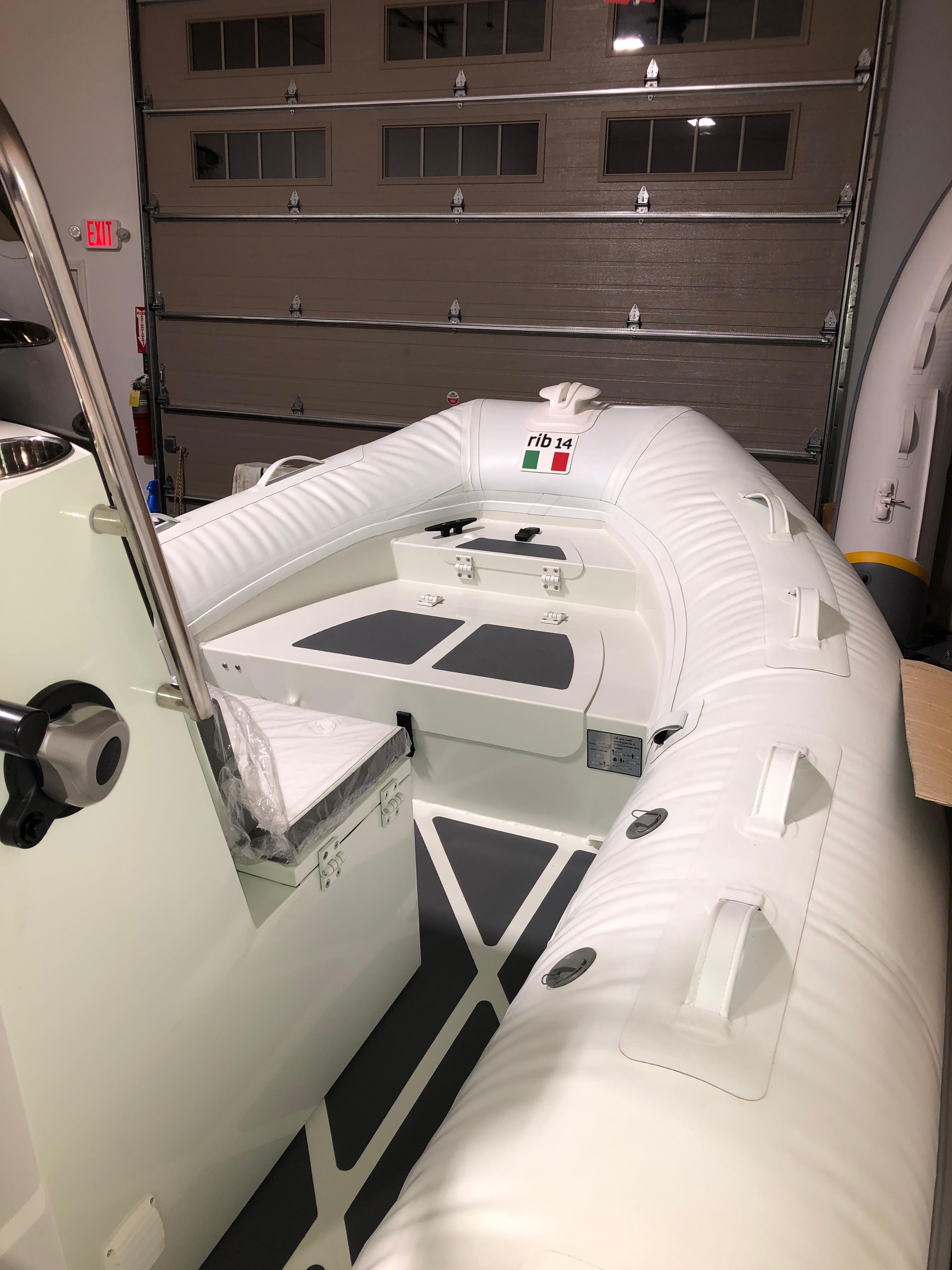 2022 ZAR Mini RIB 14 HDL inflatable boat in a garage.