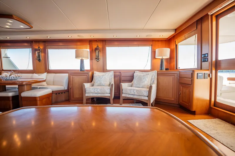 Beba Yacht Photos Pics Luxurious interior of a 2003 Fleming 75 yacht with elegant seating and wooden finishes.