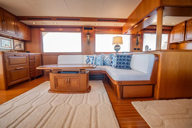 Beba Yacht Photos Pics Luxurious 2003 Fleming 75 yacht interior with elegant wood finish and cozy seating area.