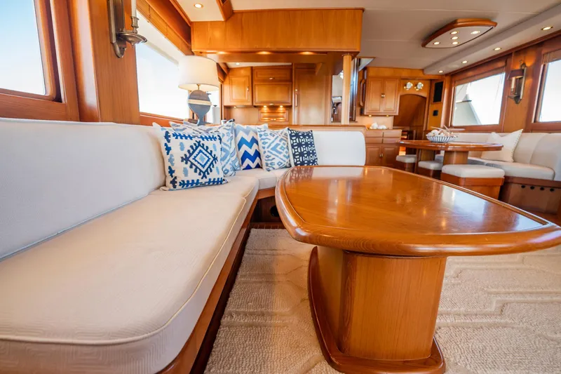 Beba Yacht Photos Pics Luxurious interior of a 2003 Fleming 75 yacht with elegant wood finishes and plush seating.