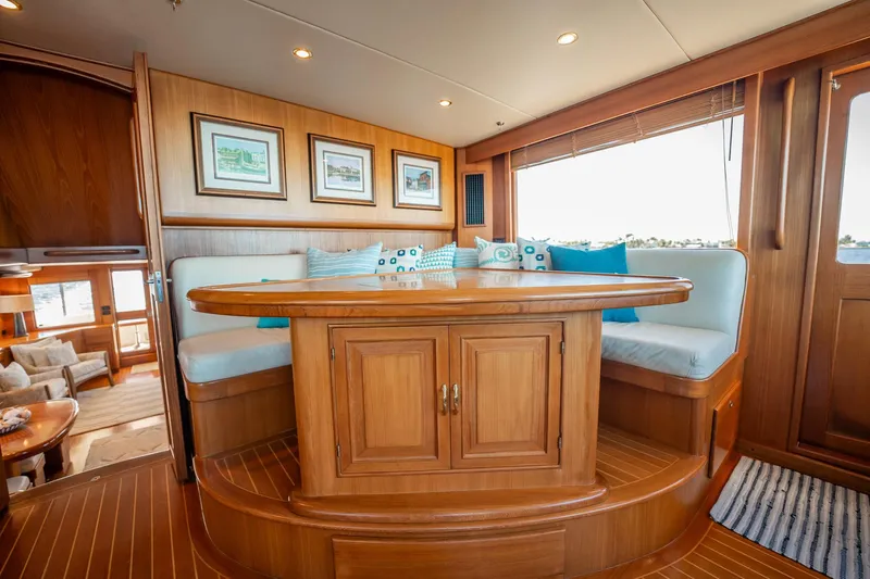 Beba Yacht Photos Pics Luxurious interior of 2003 Fleming 75 yacht with elegant wood finish and cozy seating area.