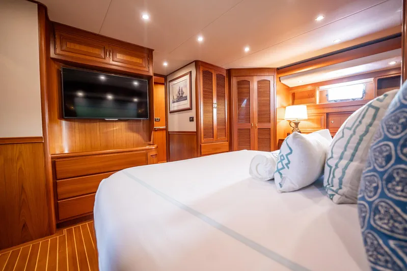 Beba Yacht Photos Pics Luxurious cabin interior of a 2003 Fleming 75 yacht with elegant wood finishes.