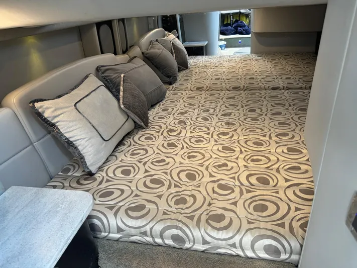 Sonatella Yacht Photos Pics Luxurious interior cabin of 2017 Formula 400 Super Sport with patterned bedding and cushions.