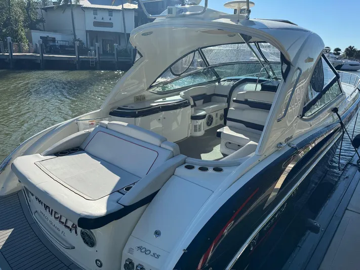 Sonatella Yacht Photos Pics 2017 Formula 400 Super Sport luxury boat docked by the water.