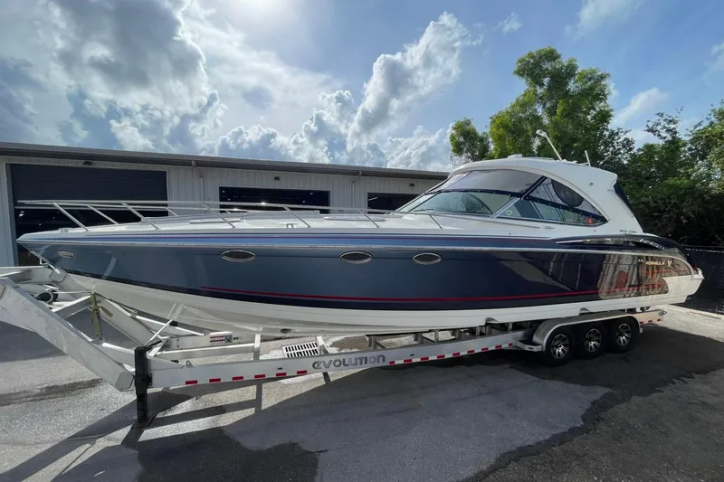 Sonatella Yacht Photos Pics 2017 Formula 400 Super Sport boat on trailer under cloudy sky.