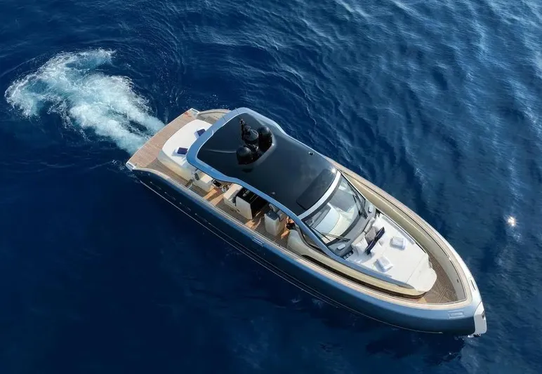 Montenegrina Yacht Photos Pics 2023 Invictus TT460 yacht cruising on open blue water.
