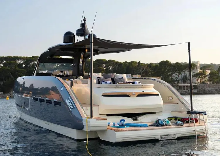 Montenegrina Yacht Photos Pics 2023 Invictus TT460 yacht anchored, showcasing luxury design and spacious deck.