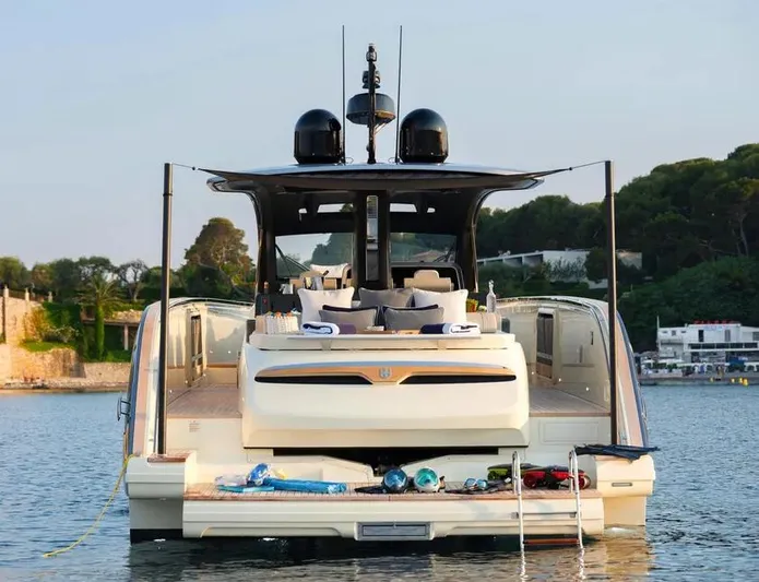 Montenegrina Yacht Photos Pics 2023 Invictus TT460 yacht with luxurious deck, anchored in serene waters.