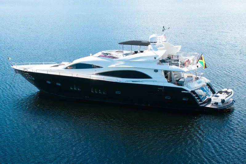 Sukha Yacht Photos Pics 2008 Sunseeker 90 Yacht on calm water, featuring sleek design and luxury amenities.