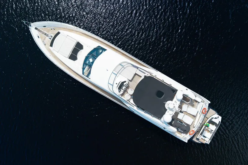 Sukha Yacht Photos Pics Aerial view of 2008 Sunseeker 90 Yacht on dark water.