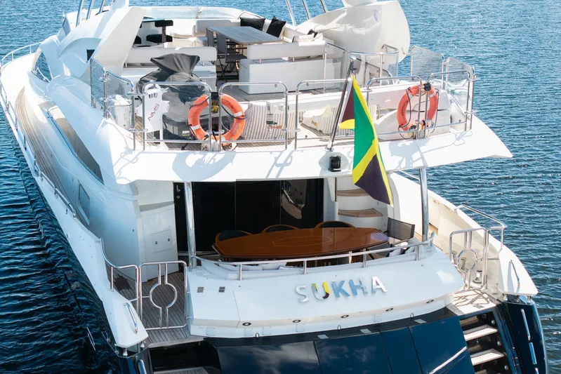 Sukha Yacht Photos Pics Luxurious 2008 Sunseeker 90 Yacht on water, featuring spacious deck and elegant design.