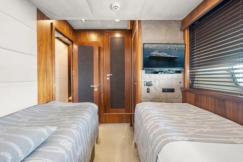Sukha Yacht Photos Pics Luxurious twin bedroom on 2008 Sunseeker 90 Yacht with elegant wood finishes.