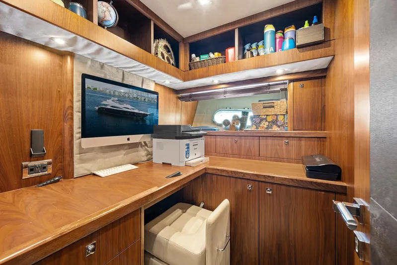 Sukha Yacht Photos Pics Luxurious office space on 2008 Sunseeker 90 Yacht with wood finish and modern amenities.