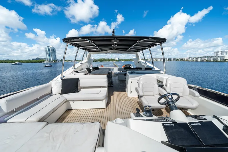 Sukha Yacht Photos Pics Luxurious 2008 Sunseeker 90 Yacht with spacious deck and scenic waterfront view.