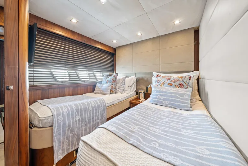 Sukha Yacht Photos Pics Luxurious twin bedroom on 2008 Sunseeker 90 Yacht with elegant decor and soft lighting.