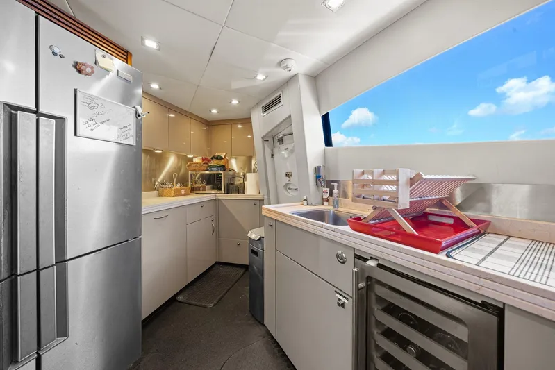 Sukha Yacht Photos Pics Modern kitchen interior on 2008 Sunseeker 90 Yacht with stainless steel appliances and ocean view.
