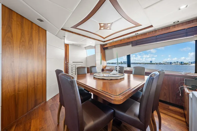 Sukha Yacht Photos Pics Luxurious dining area on a 2008 Sunseeker 90 Yacht with panoramic ocean views.