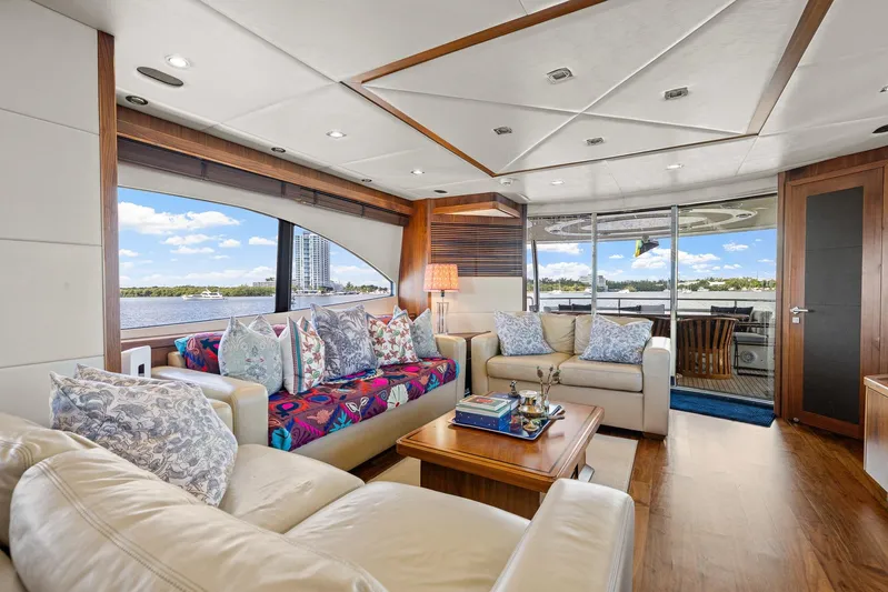 Sukha Yacht Photos Pics Luxurious interior of 2008 Sunseeker 90 Yacht with elegant seating and scenic water views.