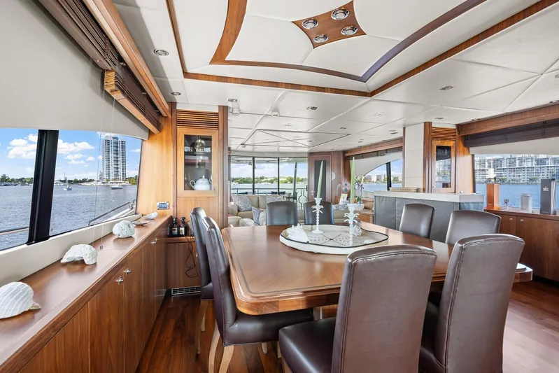 Sukha Yacht Photos Pics Luxurious interior of 2008 Sunseeker 90 Yacht with elegant dining area and waterfront view.