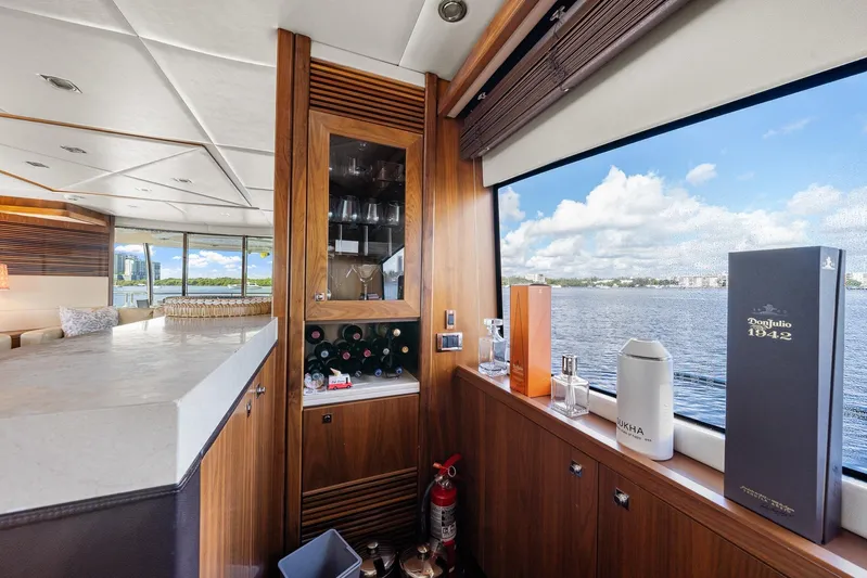 Sukha Yacht Photos Pics Luxurious interior of 2008 Sunseeker 90 Yacht with bar and scenic water view.
