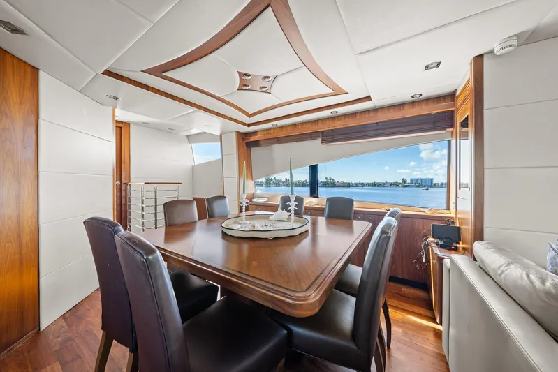 Sukha Yacht Photos Pics Luxurious interior of 2008 Sunseeker 90 Yacht with elegant dining area and scenic window view.