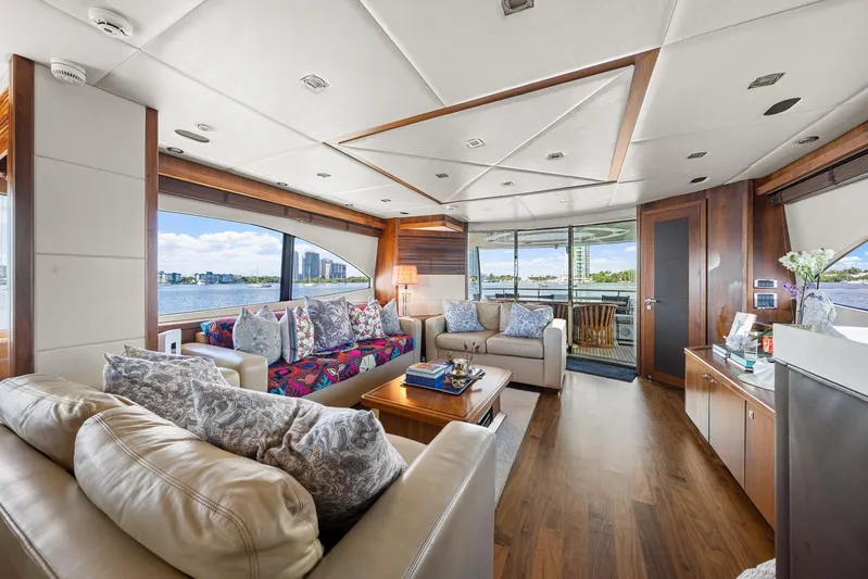 Sukha Yacht Photos Pics Luxurious interior of 2008 Sunseeker 90 Yacht with elegant seating and panoramic windows.