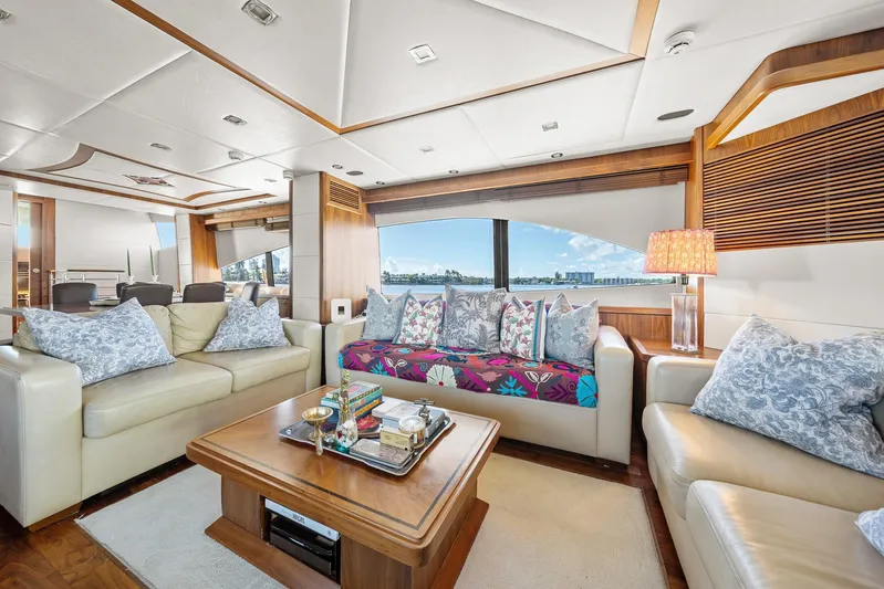 Sukha Yacht Photos Pics Luxurious interior of 2008 Sunseeker 90 Yacht with elegant seating and panoramic window view.