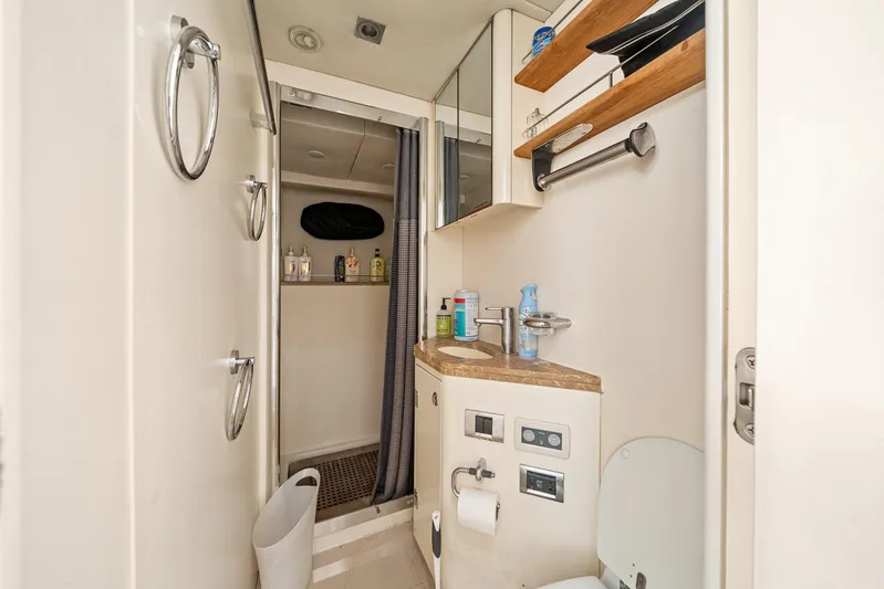 Sukha Yacht Photos Pics Bathroom interior of 2008 Sunseeker 90 Yacht with shower and vanity.