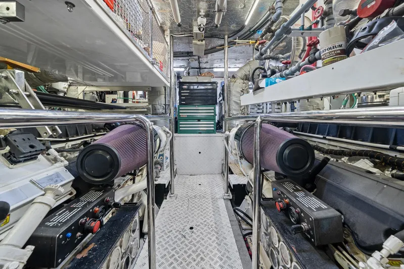 Sukha Yacht Photos Pics Engine room of 2008 Sunseeker 90 Yacht, featuring complex machinery and equipment.