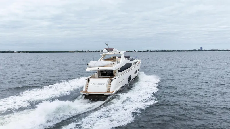 Bon Bon Yacht Photos Pics 2012 Ferretti Yachts 800 cruising on open water, rear view.