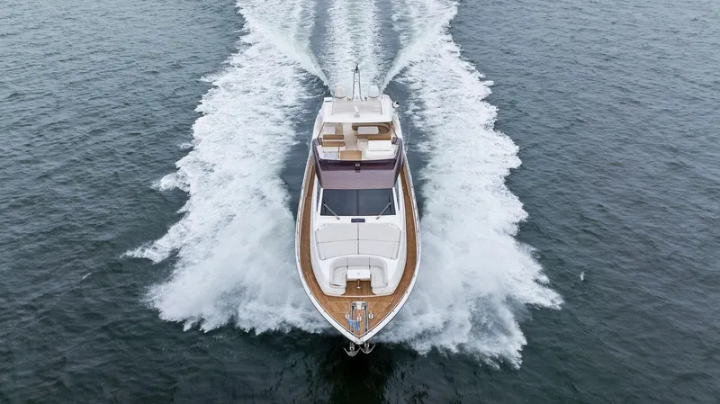 Bon Bon Yacht Photos Pics 2012 Ferretti Yachts 800 cruising on open water, aerial view.