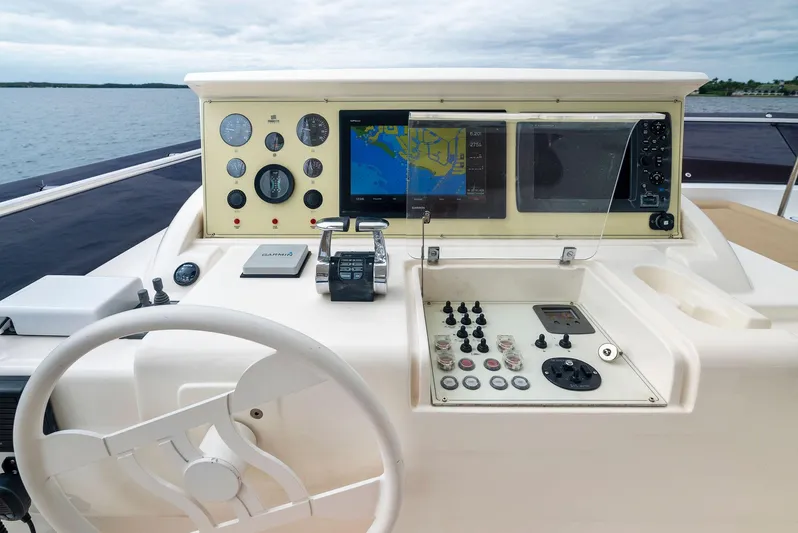 Bon Bon Yacht Photos Pics Ferretti Yachts 800 2012 helm with navigation controls and steering wheel.