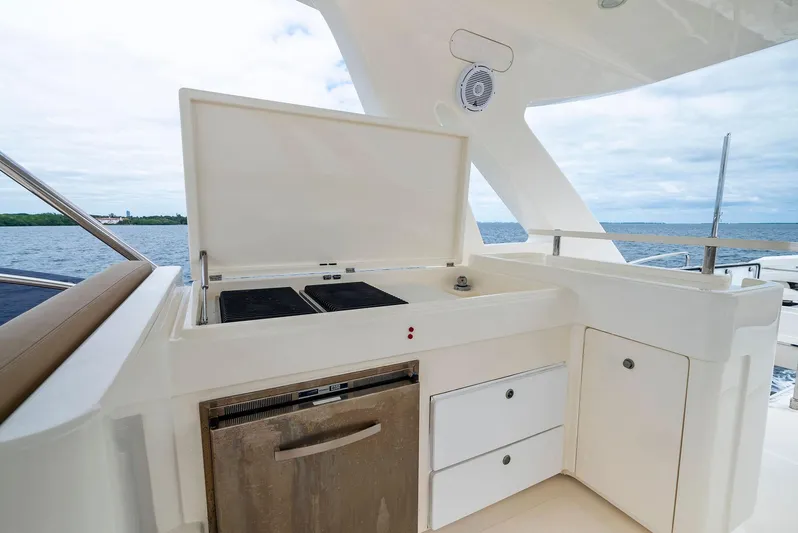 Bon Bon Yacht Photos Pics Outdoor kitchen on 2012 Ferretti Yachts 800, featuring grill and storage, with ocean view.