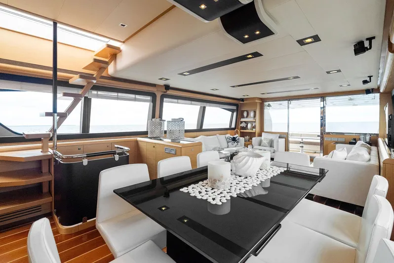 Bon Bon Yacht Photos Pics Luxurious interior of 2012 Ferretti Yachts 800 with elegant dining area and panoramic windows.