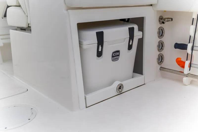  Yacht Photos Pics 2023 Edgewater 248 CX boat interior with built-in cooler storage compartment.