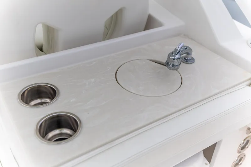  Yacht Photos Pics 2023 Edgewater 248 CX boat sink and cup holders on deck.