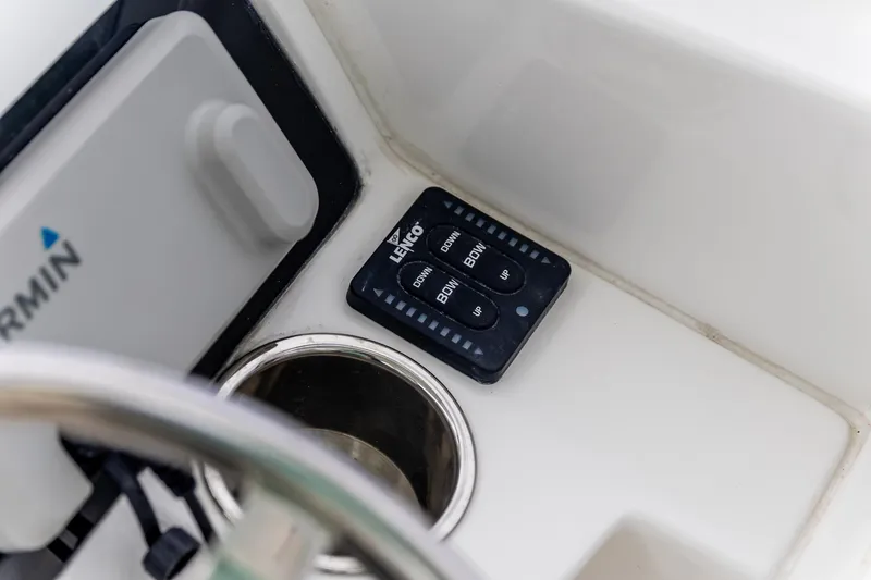  Yacht Photos Pics 2023 Edgewater 248 CX boat dashboard with Garmin and Lenco controls.