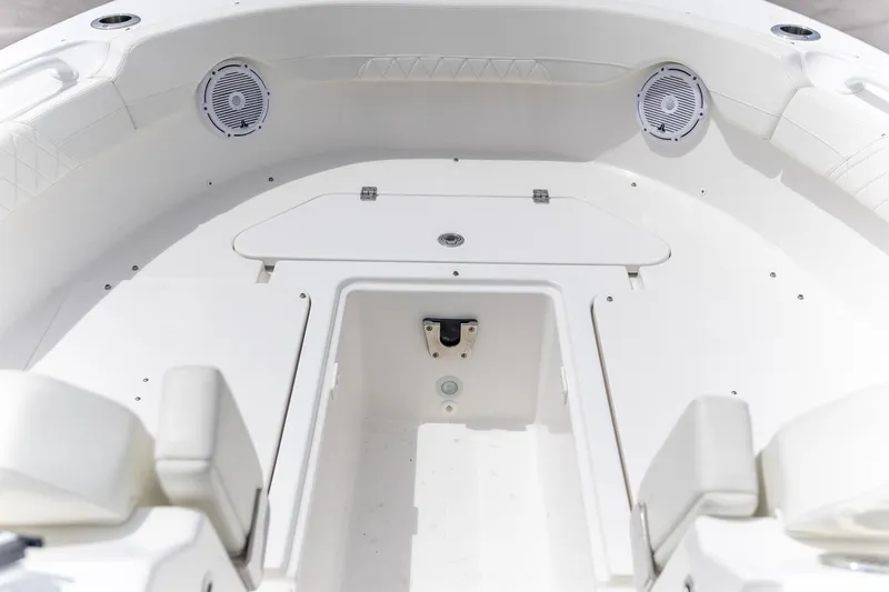  Yacht Photos Pics 2023 Edgewater 248 CX boat interior with speakers and seating.