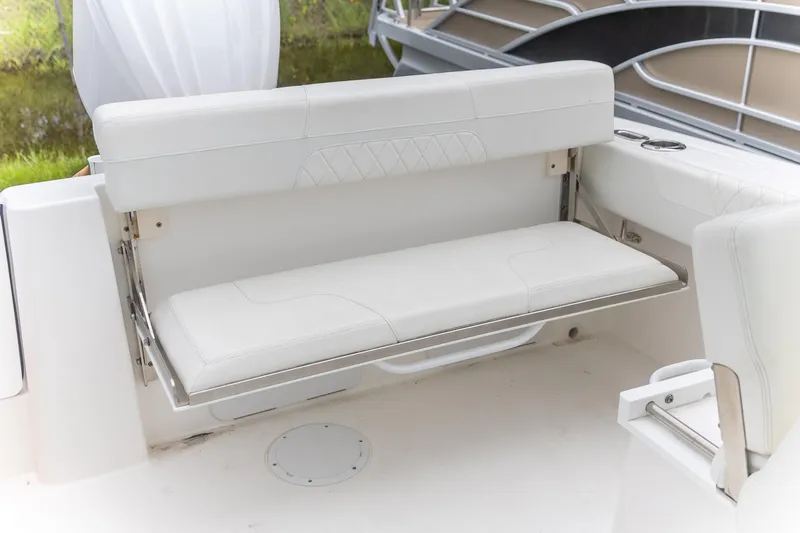  Yacht Photos Pics 2023 Edgewater 248 CX boat with white foldable bench seat and cup holders.