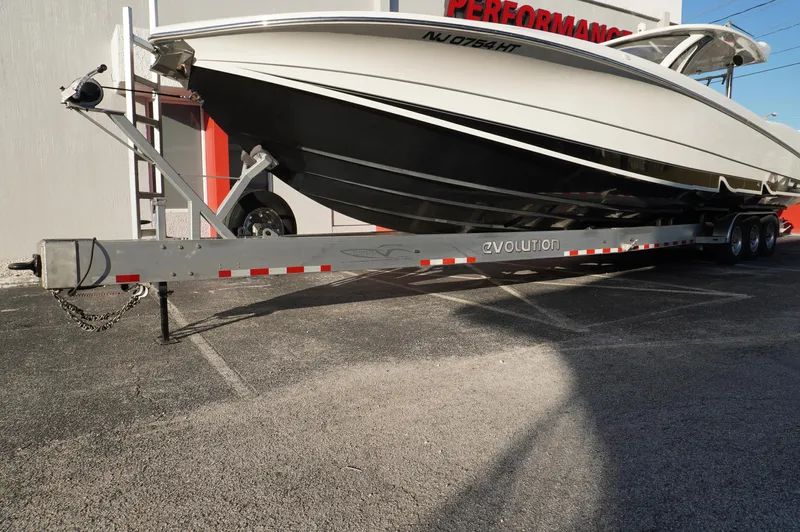  Yacht Photos Pics 2015 MTI 42 XSF boat on trailer, parked outside a performance shop.