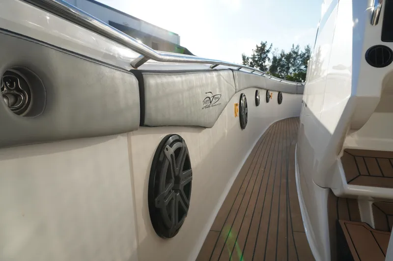  Yacht Photos Pics 2015 MTI 42 XSF boat deck with speakers and wood flooring.