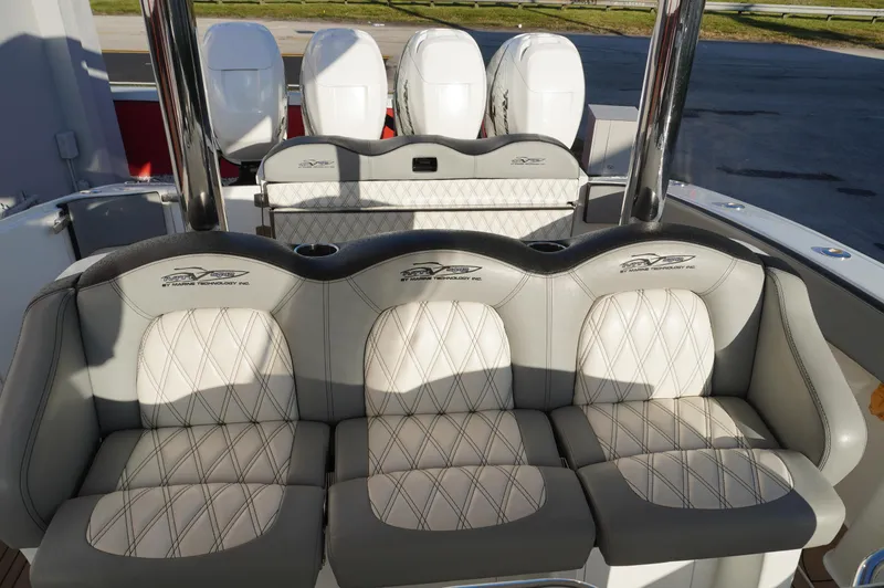  Yacht Photos Pics 2015 MTI 42 XSF boat seating with quilted upholstery and multiple outboard engines.