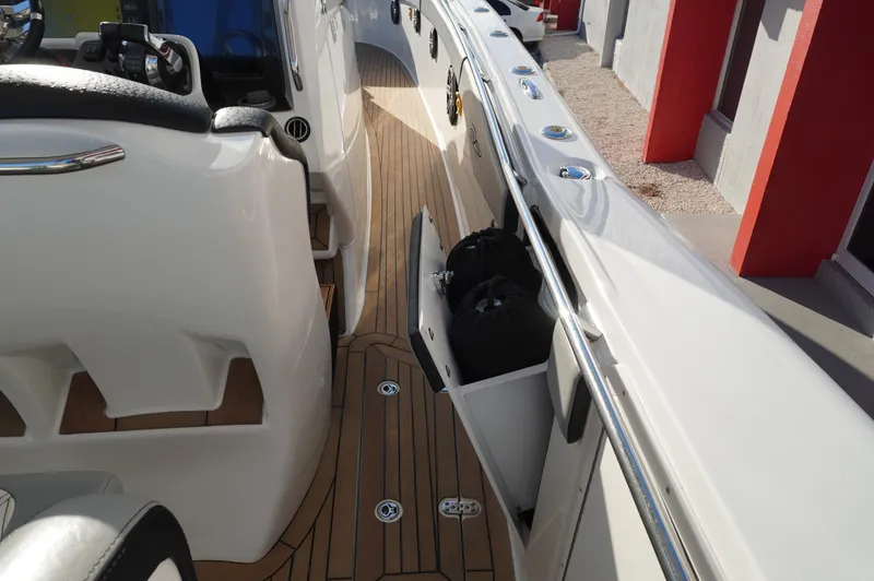  Yacht Photos Pics 2015 MTI 42 XSF boat interior with teak flooring and storage compartments.