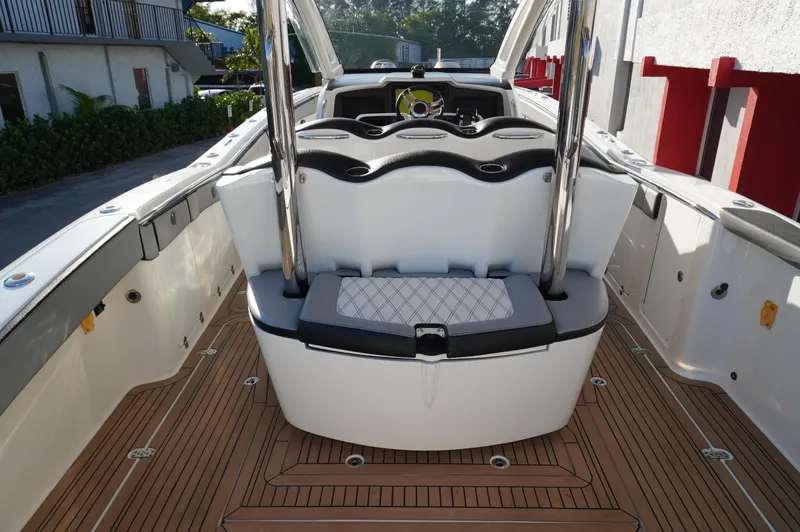  Yacht Photos Pics 2015 MTI 42 XSF boat interior with sleek seating and wooden deck.
