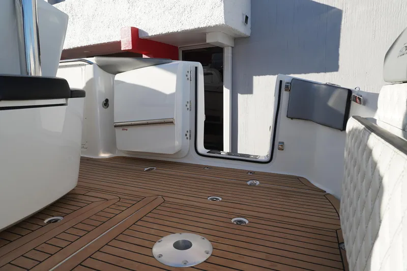  Yacht Photos Pics 2015 MTI 42 XSF boat with teak deck and open cabin door.