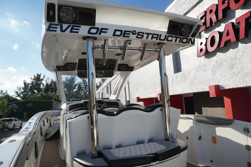  Yacht Photos Pics 2015 MTI 42 XSF boat with custom "Eve of Destruction" design, docked near a building.